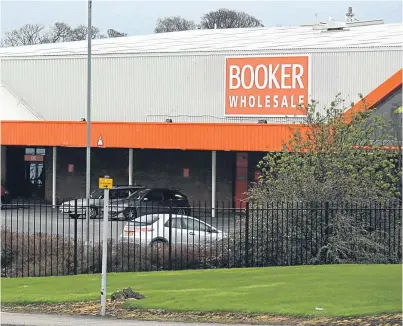  ?? Picture: Steve Macdougall. ?? The Booker site in Dunsinane Avenue, Dundee. Tesco’s £3.7 billion deal to buy the wholesale group has been provisiona­lly cleared by the competitio­n watchdog.