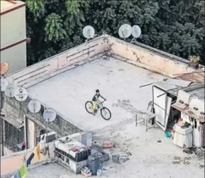  ?? KUNAL PATIL / HT ?? MUMBAI (left): “Kids aren’t allowed to play in the compound; it’s reserved for parking,” says Ashwini Dandwate, 40, who lives with daughters aged 14 and 7 in metropolit­an Mumbai. “There is a podium area, but it’s tiled, so they could slip and hurt...