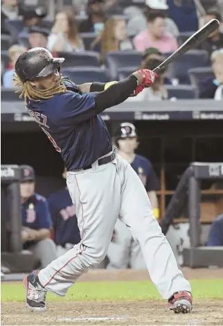  ?? AP PHOTOS ?? DEEP IMPACT: Hanley Ramirez (above) and Andrew Benintendi both hit home runs last night as the Red Sox bounced back from Thursday’s loss in the series opener to beat the Yankees, 4-1, at Yankee Stadium.