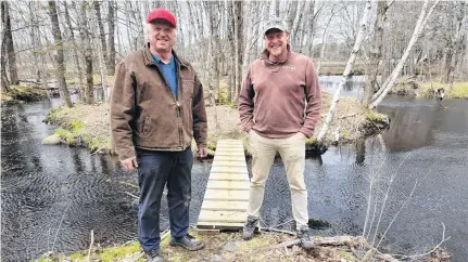  ?? MATTHEW HEBB ?? Glen Hebb, left, and Jonathan Lewis are shown on the 3.5-kilometre Indian Garden Farms Hiking Trail recently opened in Hebbville. Hebb donated the use of the land around the edge of his farming operation, and Lewis organized volunteer work crews to create the medium-difficulty trail for hikers and mountain bikers.