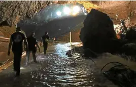  ?? —AP ?? WATERY CAVERN This photo tweeted by Elon Musk shows efforts under way to rescue trapped members of a youth soccer team from a flooded cave in northern Thailand.