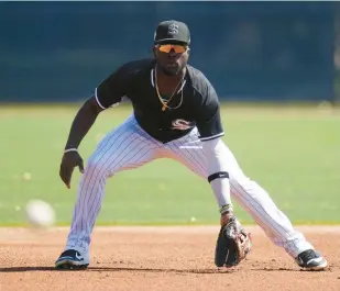  ?? ROSS D. FRANKLIN/AP ?? Chicago White Sox third baseman Bryan Ramos gets ready to field a grounder during a minor-league spring training intrasquad scrimmage, March 10, in Phoenix.