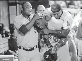  ?? — THE ASSOCIATED PRESS FILES ?? The story of sensationa­l Dodgers rookie Yasiel Puig, centre, has been overshadow­ed by the A-Rod media circus.