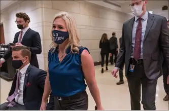  ?? AP Photo/j. Scott Applewhite ?? Northwest Georgia Rep. Marjorie Taylor Greene, R-rome, walks with fellow House Republican­s on Capitol Hill on Wednesday following a meeting called by House Minority Leader Kevin Mccarthy.