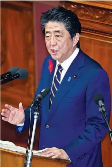  ?? AFP ?? Abe’s pledge to support the economy comes amid worsening exports.