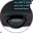  ??  ?? The strap loop
and tabs covering
the USB/3.5MM
ports are in the
recessed base