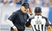  ?? THE ASSOCIATED PRESS ?? Atlanta Falcons coach Dan Quinn talks with side judge James Coleman during the first half of their game against the Detroit Lions on Sunday.