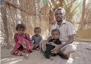  ?? ?? Yehya Hayba and his children, who fled fighting between Huthi rebels and the Saudi-backed government forces, stay at the al-Sumya camp.