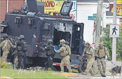  ?? CP PHOTO ?? Emergency response officers enter a residence in Moncton, N.B., on June 5, 2014. Three years after a gunman’s rampage left three Mounties dead, the RCMP itself faces trial today. The Labour Code trial stems from the force’s response to the 2014...