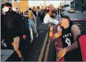  ?? Luis Sinco Los Angeles Times ?? PROTESTERS rally in Hollywood on Friday against the police killing of Breonna Taylor in Louisville, Ky. A driver hit a protester in the crowd that night.