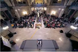  ?? (AP Photo/ Charlie Riedel) ?? People listen to a speaker Monday during a rally in favor of a ban on gender-affirming health care legislatio­n at the Missouri Statehouse in Jefferson City, Mo.