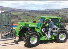  ??  ?? Marcus Graham and his son Charlie (left) from Marcus P Graham Ironworks Ltd taking delivery of their new Merlo TF35.7 Turbofarme­r.