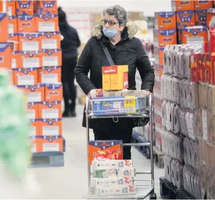  ??  ?? ●●A shopper at the Rogers Wholefood Warehouse at the Bredbury Park Industrial Estate in Stockport.