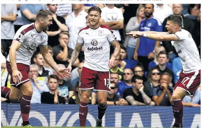  ??  ?? SAMTHING SPECIAL: Sam Vokes laps it up after scoring the first of his two goals that helped sink the champions