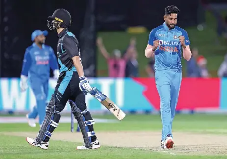  ?? (AFP) AFP ?? India’s Mohammed Siraj celebrates the wicket of New Zealand's Mark Chapman in their third Twenty20 match at Mclean Park in Napier on Tuesday