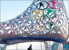  ?? BRENDAN SMIALOWSKI/AFP ?? A man walks through the Gangneung Olympic Village in Gangneung yesterday.