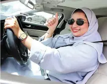  ??  ?? FREEDOM TO DRIVE – Saudi women like Zuhoor Assiri of Dhahran take the wheel for the first time in decades after the kingdom lifted a ban on women motorists. (Reuters)