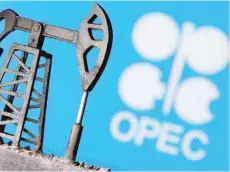  ?? — Reuters ?? A 3D printed oil pump jack is seen in front of displayed Opec logo in this illustrati­on picture.