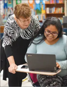  ?? PHOTOS BY JENNIFER ELLIS/THREE RIVERS EDITION ?? Kathy Walter helps senior Madelline Lopez with her Algebra 3 homework during a tutoring period. Walter, an English as a second language teacher at Batesville High School, was presented with the Citizens Bank Above and Beyond Award for September.