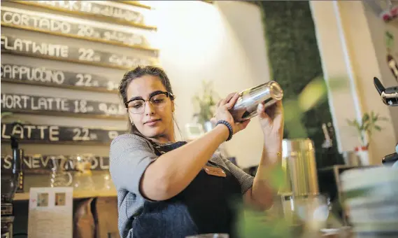  ?? PHOTOS: IMAN AL-DABBAGH/FOR THE WASHINGTON POST ?? Salwa al-Dharrab makes coffee at her cafe, Nabt Fenjan, one of the women-run and women-only cafes popping up in Saudi Arabia.