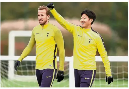  ?? — Reuters ?? Please support me: Son Heung-min (right) is hoping that Tottenham teammate Harry Kane (left) will text a good luck message before he plays for South Korea in the Asian Games football final against Japan today.