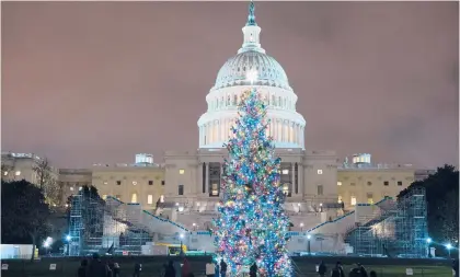  ?? JOSE LUIS MAGANA/AP ?? The Christmas tree at the U.S. Capitol, where House lawmakers approved a coronaviru­s relief bill Monday night, sending the $900 billion measure to the Senate.