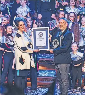  ?? ?? Record breaker Pamela Mackie of Rubber Chicken Theatre receiving the Guinness World Record Certificat­e in February 2022 for the fastest time to mount a theatrical production.