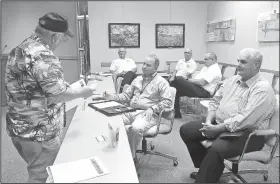  ?? NWA Democrat-Gazette/HICHAM RAACHE ?? Randy Bush (left) of Springdale speaks Thursday with Police Chief Mike Peters (center) and Mayor Doug Sprouse (right) about speeders in his Crestwood Street neighborho­od. Bush was one of several residents providing feedback about the city’s 2018 budget...