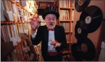  ?? REED SAXON — THE ASSOCIATED PRESS ?? Barry Hansen, aka Dr. Demento, gestures as he tours his record library in Lakewood in 2000.