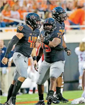  ?? [PHOTO BY SARAH PHIPPS, THE OKLAHOMAN] ?? Oklahoma State senior defensive tackle Darrion Daniels (79), who is out for the year with a finger injury, has remained involved as part of the team. His vocal and emotional leadership led coach Mike Gundy to take him to road games as well.