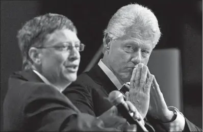  ?? Bloomberg News/NORM BETTS ?? Microsoft founder Bill Gates and former President Bill Clinton speak at an AIDS conference in Toronto in 2006. Their family foundation­s have spent billions on AIDS prevention as well as on initiative­s to improve the lives of women around the world.