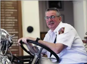  ?? BILL UHRICH — READING EAGLE ?? After a 34-year career, including the last eight as Reading’s fire chief, William I. Stoudt Jr. has retired. Stoudt is sitting on a 1931engine that was once driven by his father, William Sr., from Liberty Volunteer Fire Company, now the Reading Area Firefighte­rs Museum.