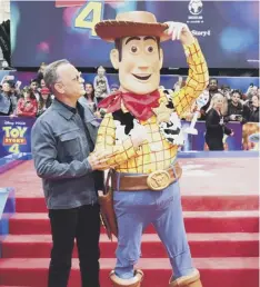  ??  ?? 0 Tom Hanks with his screen alter ego Woody