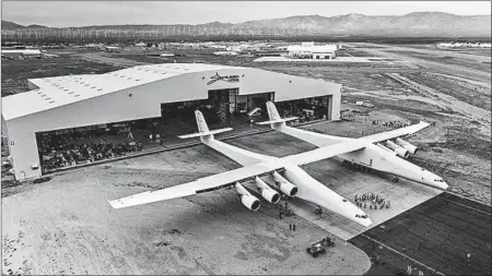  ?? STRATOLAUN­CH SYSTEMS CORP. ?? Paul Allen’s Stratolaun­ch plane sits outside its hangar in Mojave, Calif.. The giant plane is designed to carry payloads to the edge of space.