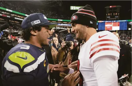  ?? Stephen Brashear / Associated Press 2019 ?? Trading quarterbac­ks to division rivals is rare, but Jimmy Garoppolo could replace Russell Wilson in Seattle.