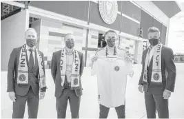  ?? INTER MIAMI CF ?? Inter Miami owners David Beckham, far right, and Jorge Mas, far left, introduced sporting director Chris Henderson, middle left, and coach Phil Neville, middle right, at Inter Miami CF Stadium in Fort Lauderdale.