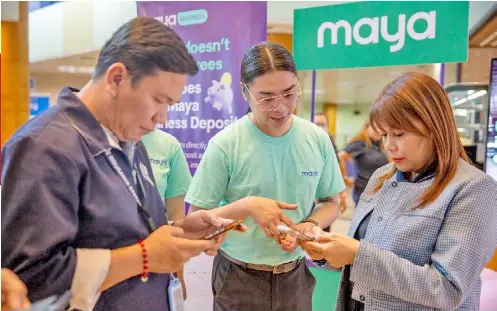  ?? The Government Service Insurance System (GSIS) teams up with Maya, the country’s only end-to-end digital payments company, as the newest online payment option for GSIS loan borrowers. Maya staff set up a booth at the GSIS Head Office in Pasay City to assi ?? DIGITAL PAYMENT.