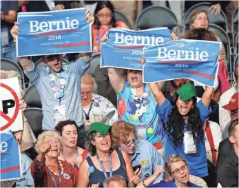  ?? MICHAEL CHOW, USA TODAY NETWORK ?? Bernie Sanders supporters cheer during the 2016 Democratic National Convention at Wells Fargo Arena. The Vermont senator was cheered for nearly every point he made.
