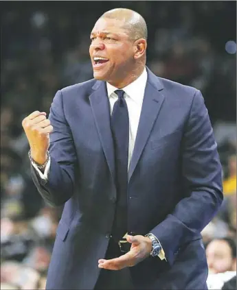  ?? Eric Gay Associated Press ?? DOC RIVERS made the Clippers an attractive destinatio­n, as he did with Orlando after only one year of coaching. Now, with an NBA title under his belt, “My body of work played in my favor this time,” he said.