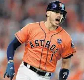  ?? RONALD MARTINEZ/GETTY ?? Carlos Correa reacts after hitting a two-run double for the Astros in the sixth inning Friday against the Red Sox.
THE SCHEDULE
Astros 8, Red Sox 2
Astros 8, Red Sox 2
at Red Sox 2:30 p.m. Sunday, FS1
at Red Sox TBD Monday, FS1
at Astros TBD...