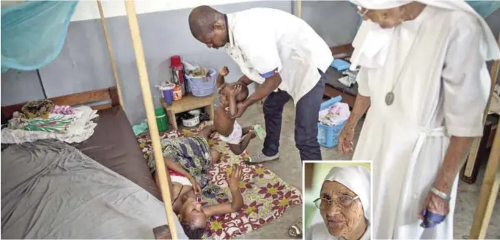  ?? — AFP photos ?? Italian nun Sister Maria Concetta, 81 (right) and one of her assistants help a mother suffering from a uterus perforatio­n caused by an unsafe abortion at Zongo Hospital in Zongo, a small village in the Equatorial region of the Democratic Republic of...