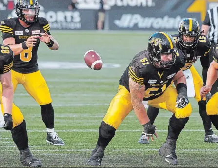  ?? JOHN RENNISON THE HAMILTON SPECTATOR ?? Mike Filer — seen here snapping the ball to QB Jeremiah Masoli on Labour Day — and his teammates want resilience to be the team’s identity.