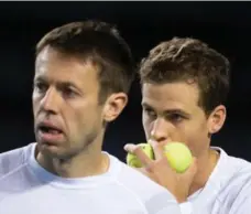  ?? DARRYL DYCK/THE CANADIAN PRESS ?? Canada’s Vasek Pospisil, left, and Daniel Nestor defeated Japan’s Go Soeda and Yasutaka Uchiyama in five sets Saturday in Davis Cup play.