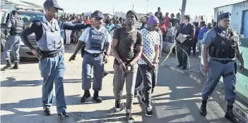  ?? PICTURE: PHANDO JIKELO ?? WALKABOUT: Athabile and Xolisa Mafilika, accused of raping and murdering Sinoxolo Mafevuka, were at the scene when the Western Cape High Court conducted an inspection in loco in Khayelitsh­a.