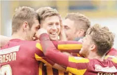  ??  ?? Bradford City’s English striker Jon Stead (2nd L) celebrates with teammates after scoring their second goal during the FA Cup fifth round football match between Bradford City and Sunderland at The Coral Windows Stadium in Bradford, northern England. -...