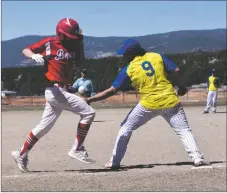  ?? JEANS PINEDA/Taos News ?? The ball flies past first baseman Elijah Lucero for an infield error on Saturday (March 26).