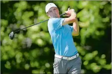  ?? JOHN WOIKE/HARTFORD COURANT VIA AP ?? Jordan Spieth follows his tee shot on the 12th hole during the first round of the Travelers Championsh­ip on Thursday at TPC River Highlands in Cromwell. Spieth, playing in the tournament for the first time, fired a 7-under 63 to take the first round...