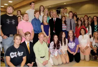  ?? PHOTOS BY LYNN KUTTER ENTERPRISE-LEADER ?? Cameras were flashing all around as Prairie Grove High students gathered to have a group photo taken with Gov. Mike Beebe. These students received cash incentives for their Advanced Placement scores on the 2013 spring tests. Beebe praised the students,...