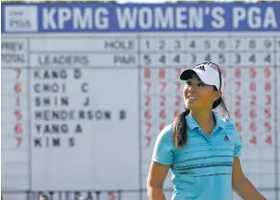  ?? CHARLES REX ARBOGAST/THE ASSOCIATED PRESS ?? Danielle Kang smiles Saturday after her birdie on the 18th green during the third round of the Women’s PGA Championsh­ip at Olympia Fields Country Club in Olympia Fields, Ill. Kang and Chella Choi shared the lead heading into the final round.