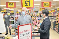  ?? ?? Royal approval: Prince Charles is given a shopfloor tour in Deeside, North Wales, in 2021, by Richard Walker, also right